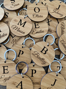 BAG TAG WITH CUT OUT INITIAL AND ENGRAVED NAME
